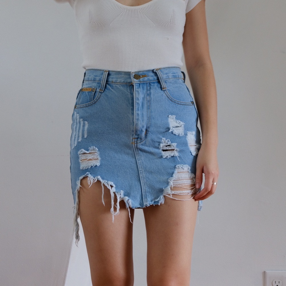 Vintage light blue distressed denim mini skirt